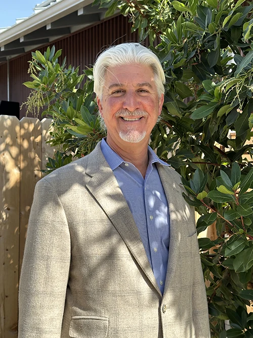 Chiropractor Christopher Tabick Smiling Warmly Greeting Patients